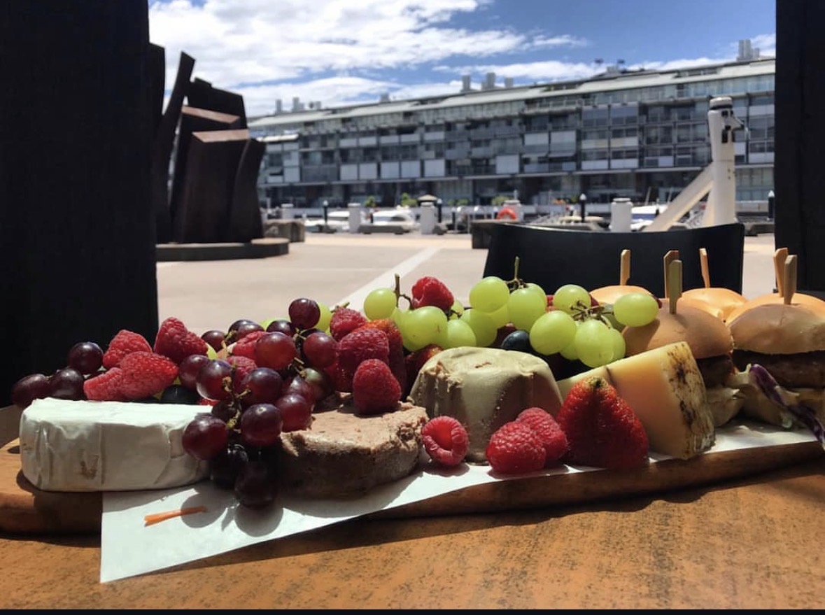Zupano waterfront grazing board with fruit, cheese and pastries
